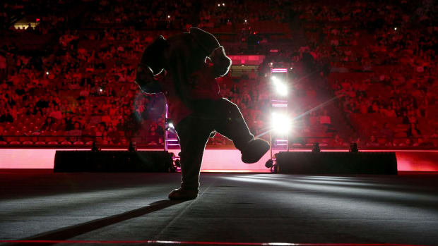 Big Al entertains the crowd before the Power of Pink Meet at Coleman Coliseum. Alabama edged Auburn 197.850 to 197.700.
